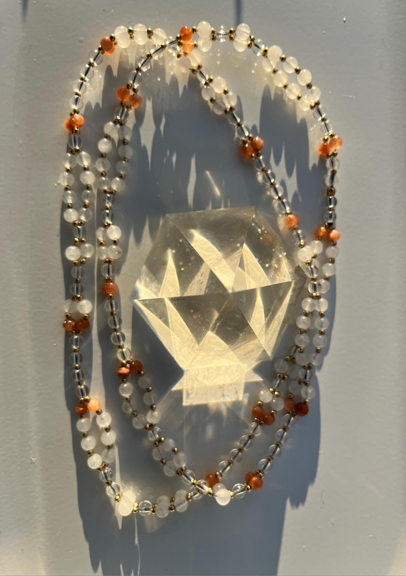 Tantric necklace with sunstone, clear quartz and white jade