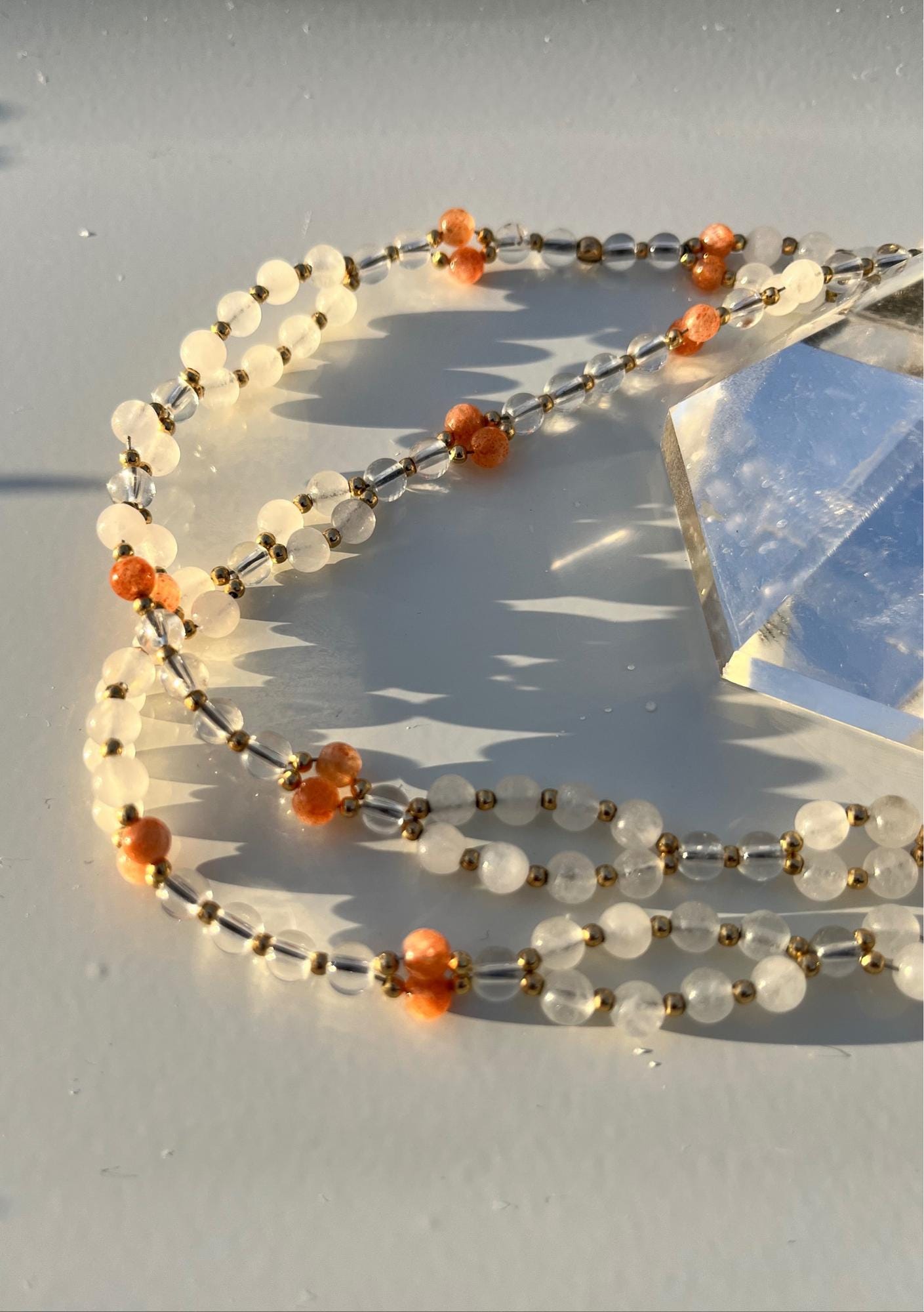 Tantric necklace with sunstone, clear quartz and white jade