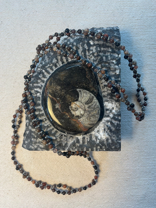Handmade tantric necklace made from petrified wood