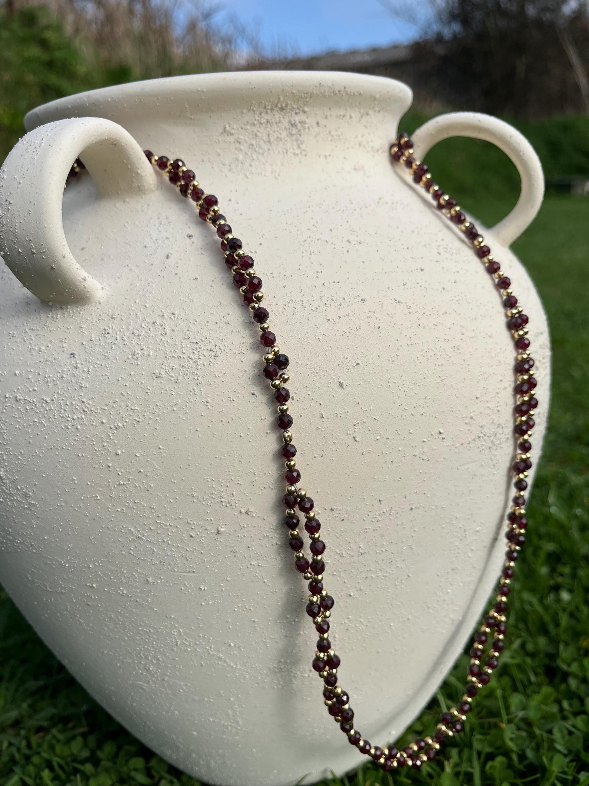 Handmade red garnet and gold vermeil tantric necklace inspired by kundalini traditions