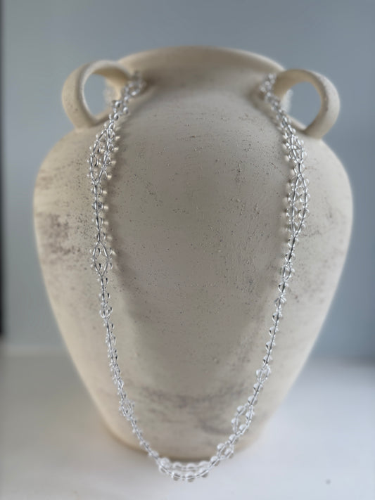 A clear quartz tantric necklace 