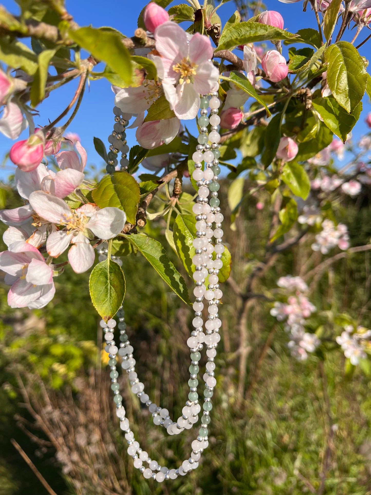Handmade rose quartz and jade tantric necklace inspired by kundalini traditions