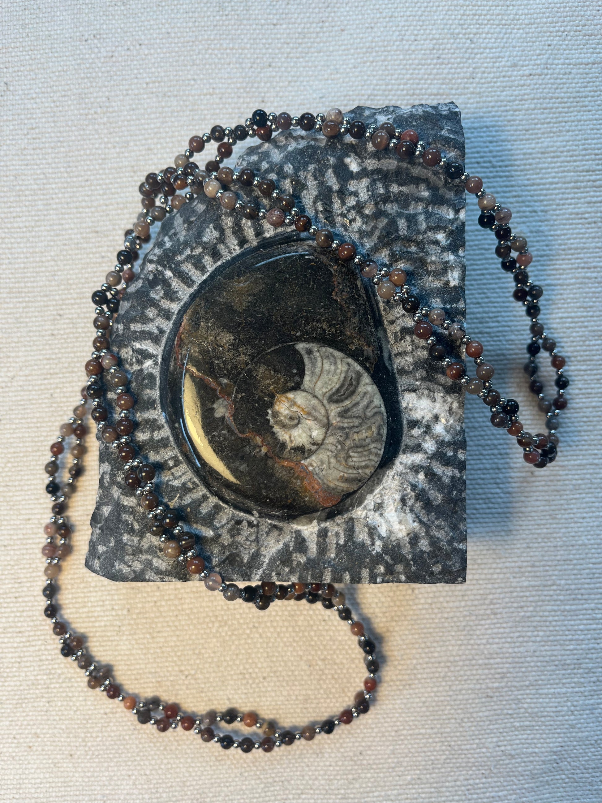 Handmade tantric necklace made from petrified wood