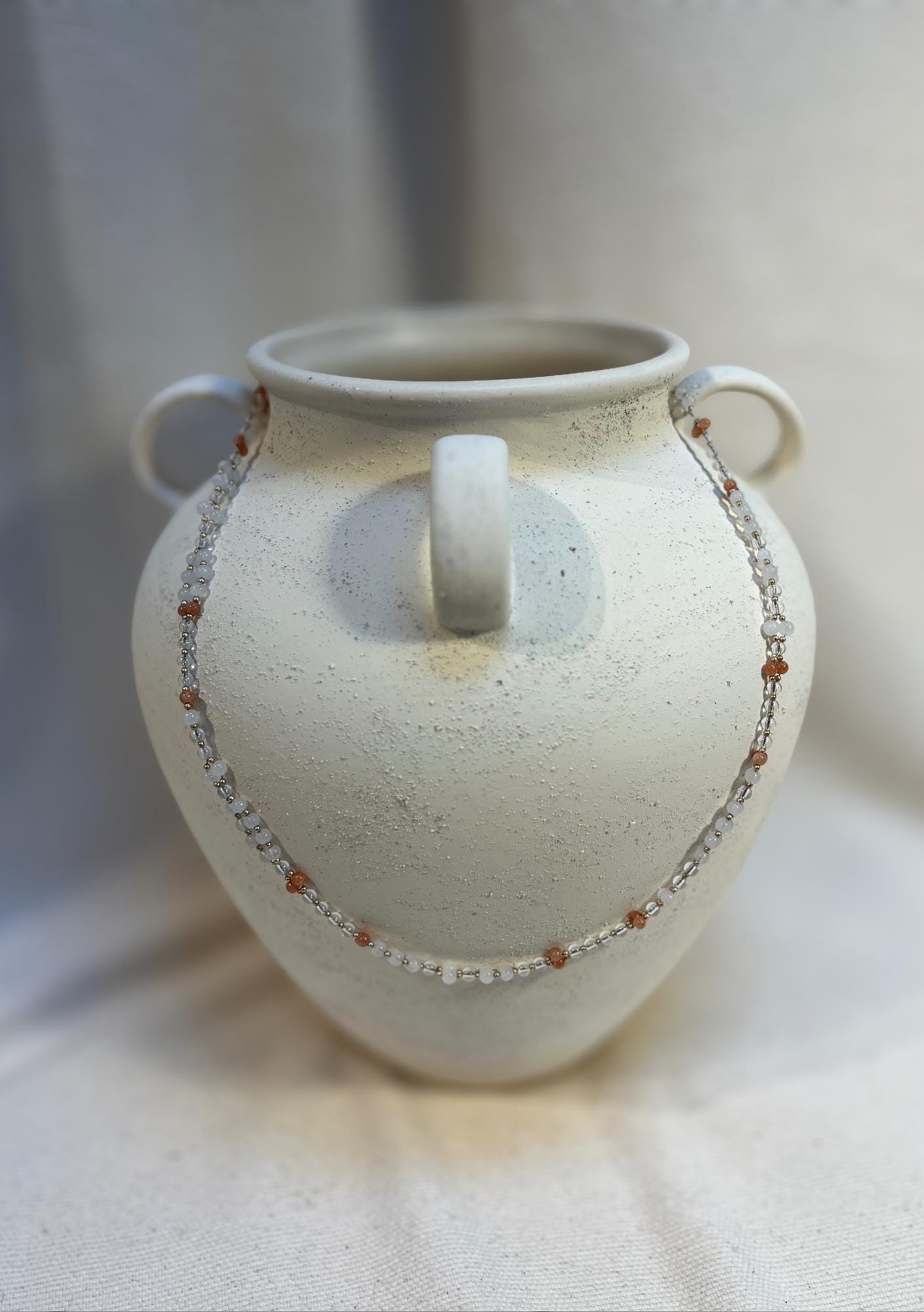 Tantric necklace with sunstone, clear quartz and white jade